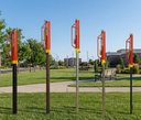 Outdoor fitness equipment with 'Kane County' branding in a park setting.